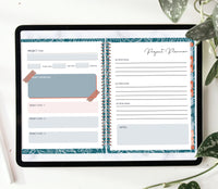 Image of an ipad on a desktop with a houseplant right by it. The digital bullet journal is opened up to a page for Project Planning.